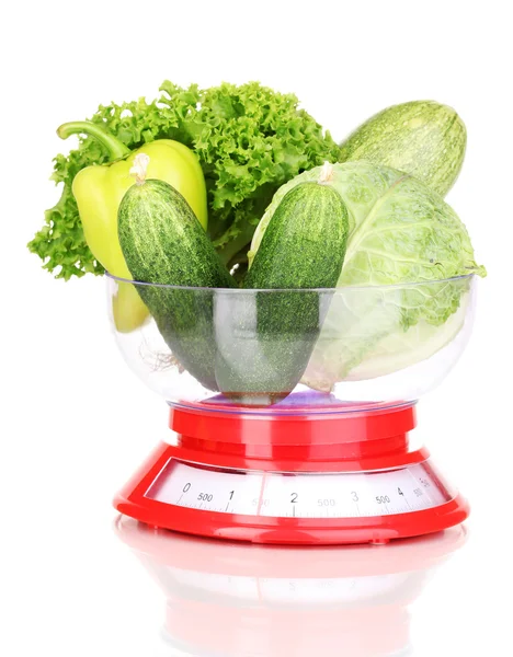 Fresh green vegetables in scales isolated on white — Stock Photo, Image