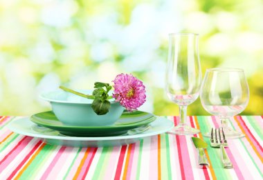 Table setting on bright background close-up