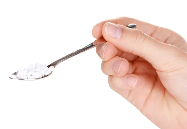 Süßstoff in Metalllöffel isoliert auf weiß — Stockfoto