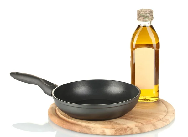 Pan with bottle of oil isolated on white — Stock Photo, Image