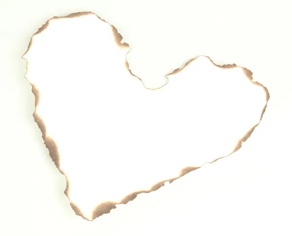 Papel em forma de coração queimado isolado sobre branco — Fotografia de Stock