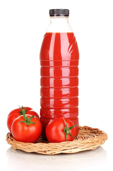 Tomato juice in bottle on wicker mat isolated on white — Stock Photo, Image