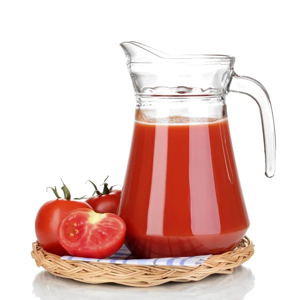 Tomato juice in pitcher on wicker mat isolated on white — Stock Photo, Image