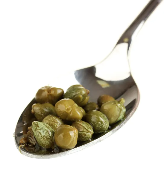 Green capers in metal spoon on white background close-up — Stock Photo, Image