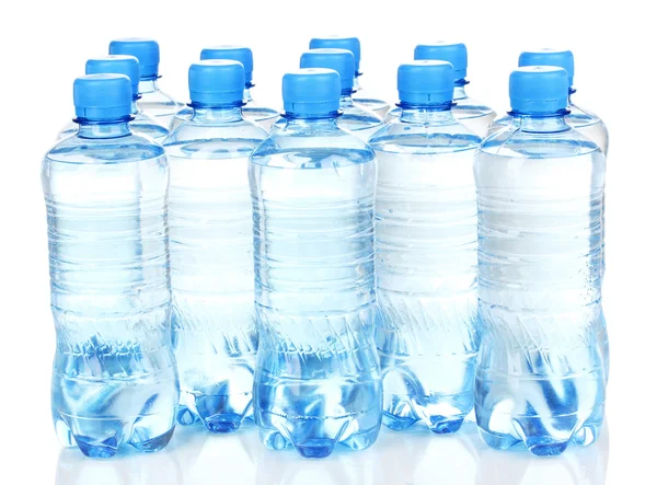 Plastic bottles of water isolated on white — Stok fotoğraf