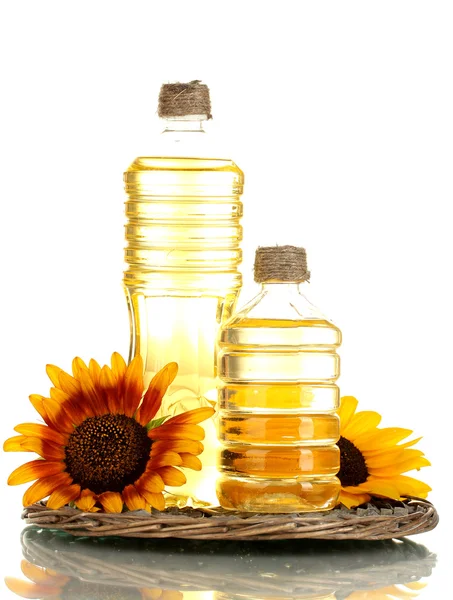 Oil in bottles and sunflowers, isolated on white — Stock Photo, Image