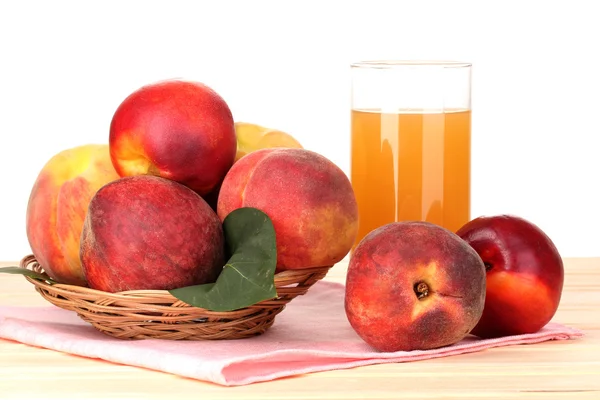 Ripe peaches and juice on wooden table on white background — Stock Photo, Image