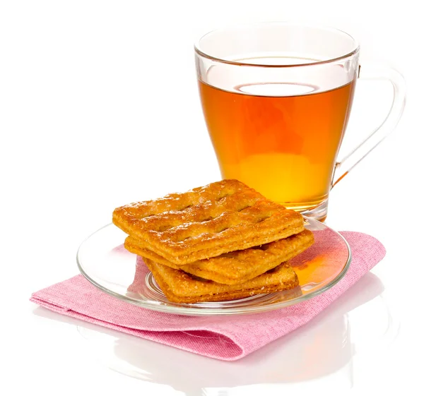 Cup of tea and cookies isolated on white — Stock Photo, Image