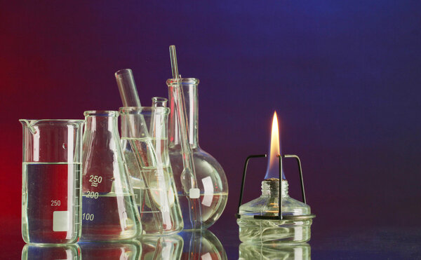 spiritlamp and test-tubes on blue-red background