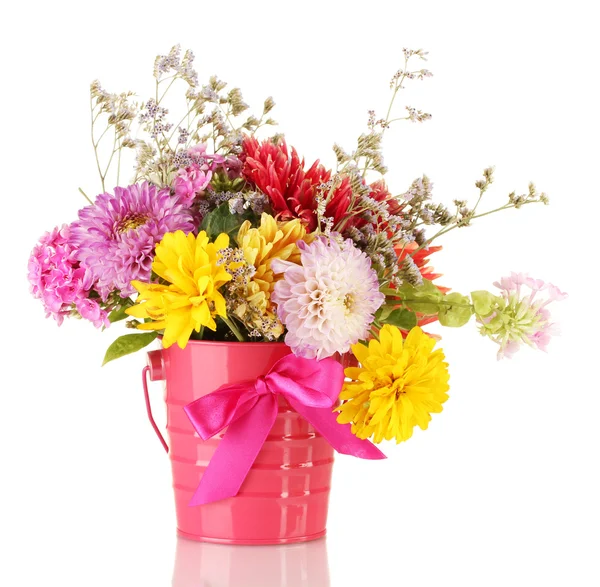 Bright pink bucket with flowers isolated on white — Stock Photo, Image