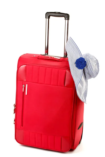 Red suitcase with woman's hat isolated on white — Stock Photo, Image