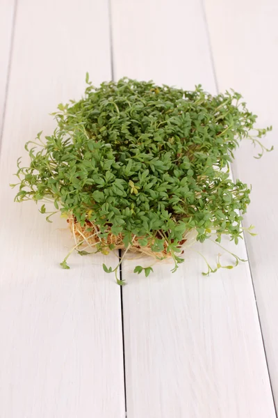 Fresh garden cress close-up on wooden table — Stock Photo, Image