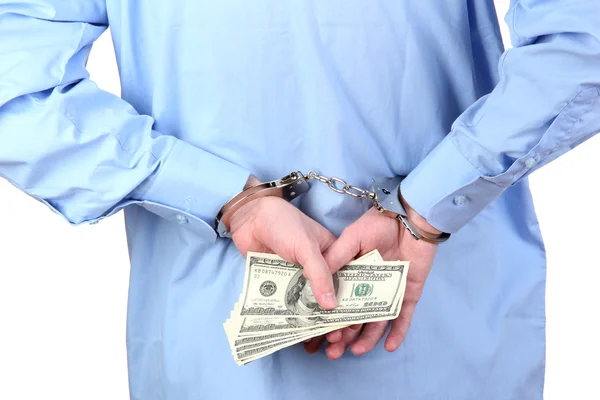Man in handcuffs is holding dollars, on white background — Stock Photo, Image