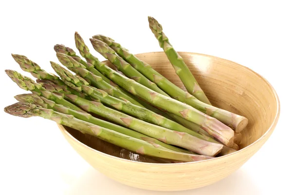 Fresh asparagus in wooden bowl isolated on white — Stock Photo, Image