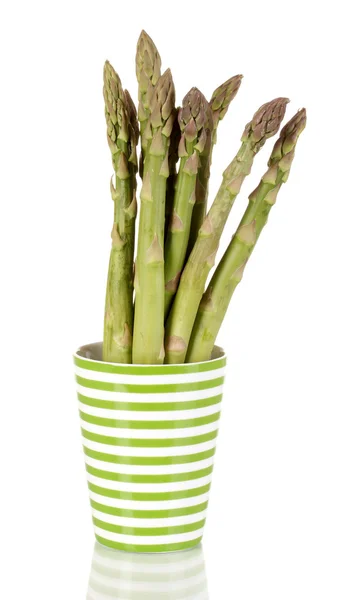 Fresh asparagus in colorful pot isolated on white — Stock Photo, Image