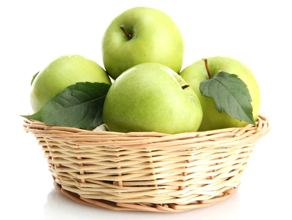 Ripe green apples with leaves in basket isolated on white — Stock Photo, Image