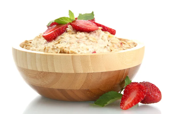 Tasty oatmeal with strawberries, isolated on white — Stock Photo, Image