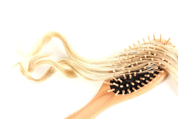 Blond curls brushing comb isolated on white — Stok Foto