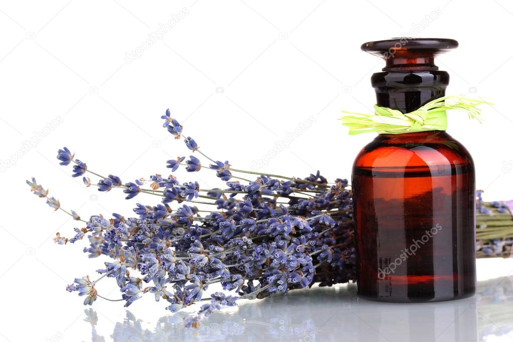 Lavender flowers and glass bottle isolated on white