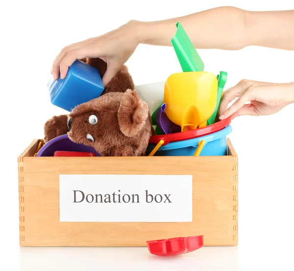 Donation box with children toys on white background close-up — Stock Photo, Image