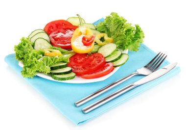 Chopped vegetables and sauce on plate isolated on white