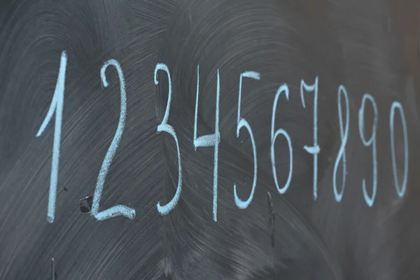 The numbers written on the desk — Stock Photo, Image