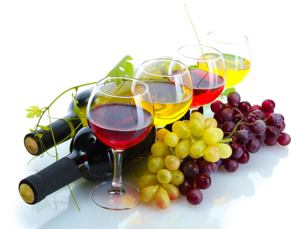bottles and glasses of wine and ripe grapes isolated on white