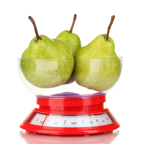 Ripe pears in kitchen scales isolated on white — Stock Photo, Image