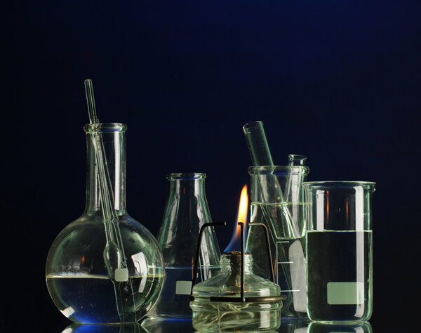 Spiritlamp and test-tubes on blue background