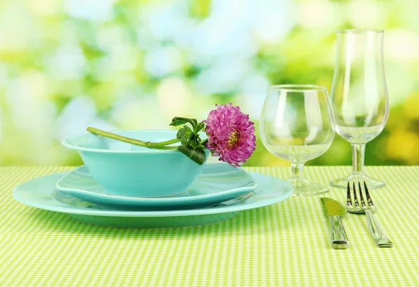 Table setting on bright background close-up — Stockfoto