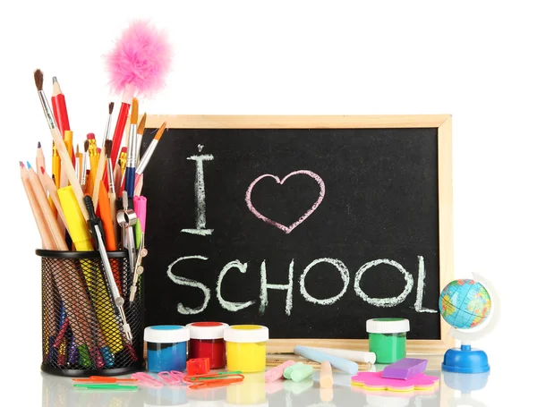 Pequeño escritorio escolar con varios útiles escolares primer plano aislado en blanco — Foto de Stock