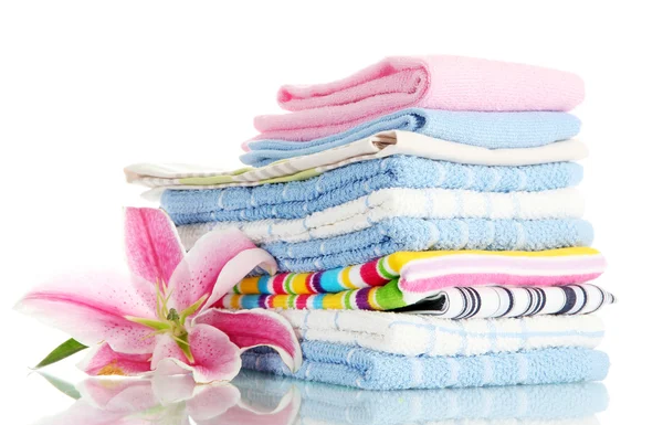 Towels with beautiful pink lily, isolated on white — Stock Photo, Image