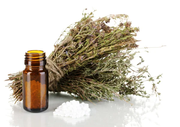 Bottle of medicines with herbs on white background. concept of homeopathy — Stock Photo, Image