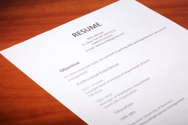 Closeup of resume on wooden table — Stock Photo, Image