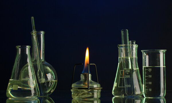 Spiritlamp and test-tubes on blue background