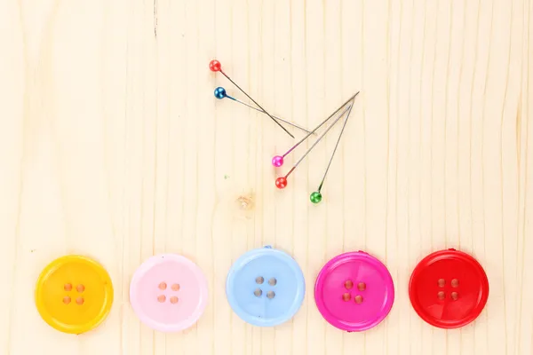 Colorful sewing buttons on wooden background — Stock Photo, Image