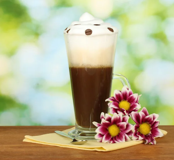Glass of fresh coffee cocktail on bright green background — Stock Photo, Image