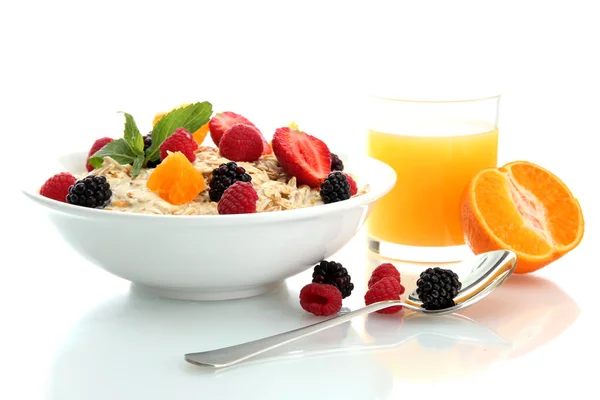 Tasty oatmeal with berries and glass of juice, isolated on white — Stock Photo, Image