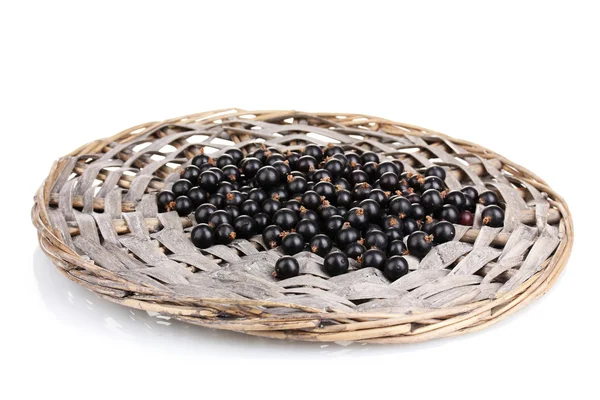 Black currant on wicker mat isolated on white — Stock Photo, Image