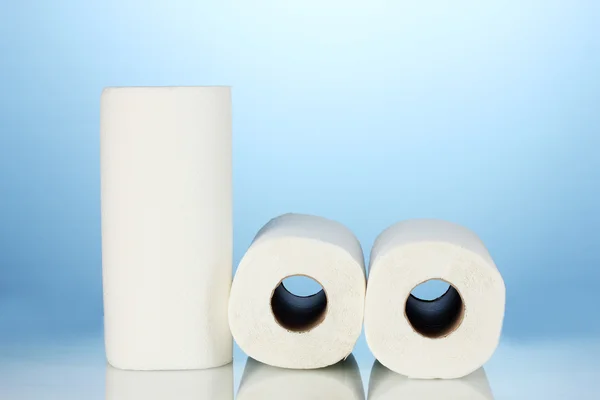 Rolls of toilet paper on blue background — Stock Photo, Image