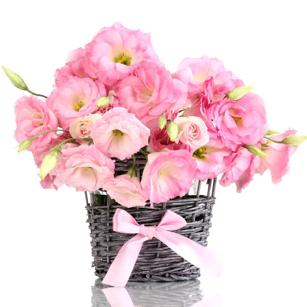 Bouquet of eustoma flowers in wicker vase, isolated on white — Stock Photo, Image