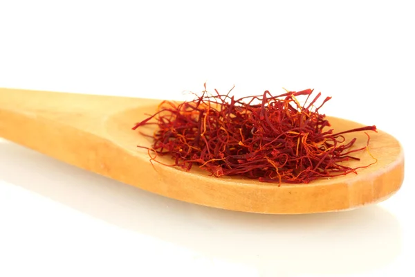 Stigmas of saffron in wooden spoon on white background close-up — Stock Photo, Image