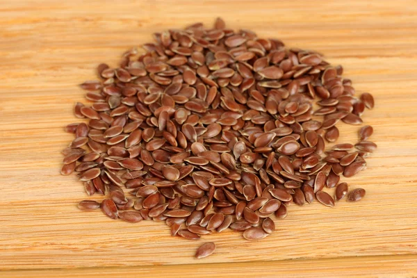 Flax seeds on wooden background close-up — Stock Photo, Image