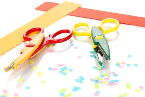 Colorful zigzag scissors with paper strips isolated on white — Stock Photo, Image