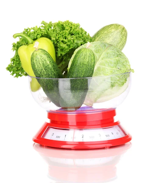 Fresh green vegetables in scales isolated on white — Stock Photo, Image