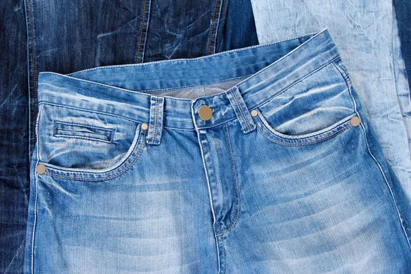 Muitas calças de ganga close-up — Fotografia de Stock