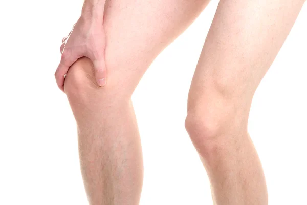 Hombre sosteniendo dolor de rodilla, aislado en blanco — Foto de Stock