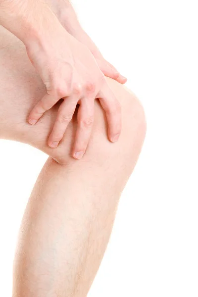 Άνθρωπος που κρατά την πληγή γόνατο, που απομονώνονται σε λευκό — Φωτογραφία Αρχείου