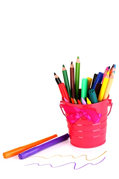 Colorful pencils and felt-tip pens in pink pail isolated on white — Stock Photo, Image