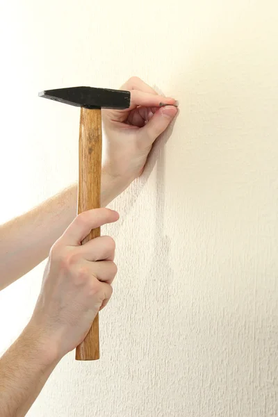 Man hands with nail and hammer — Stock Photo, Image